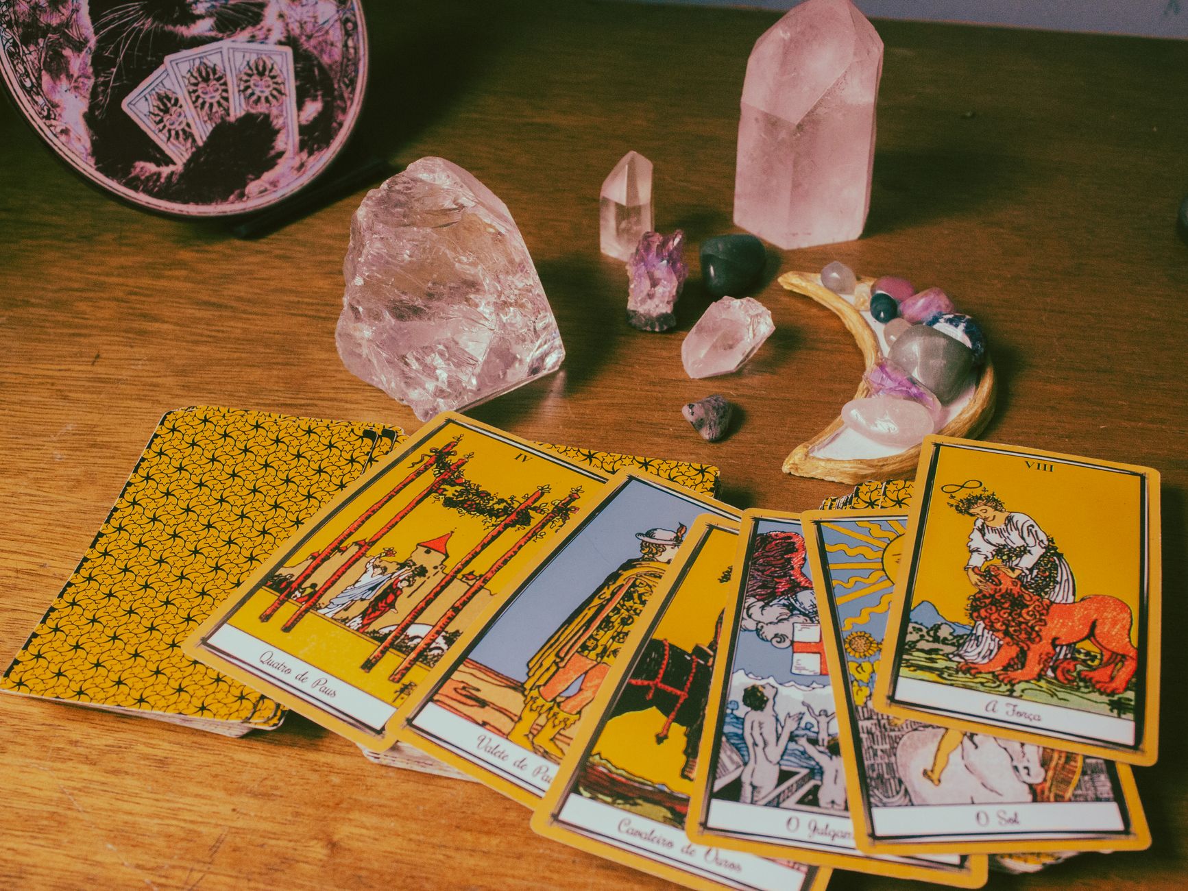 tarot cards and crystals on a table